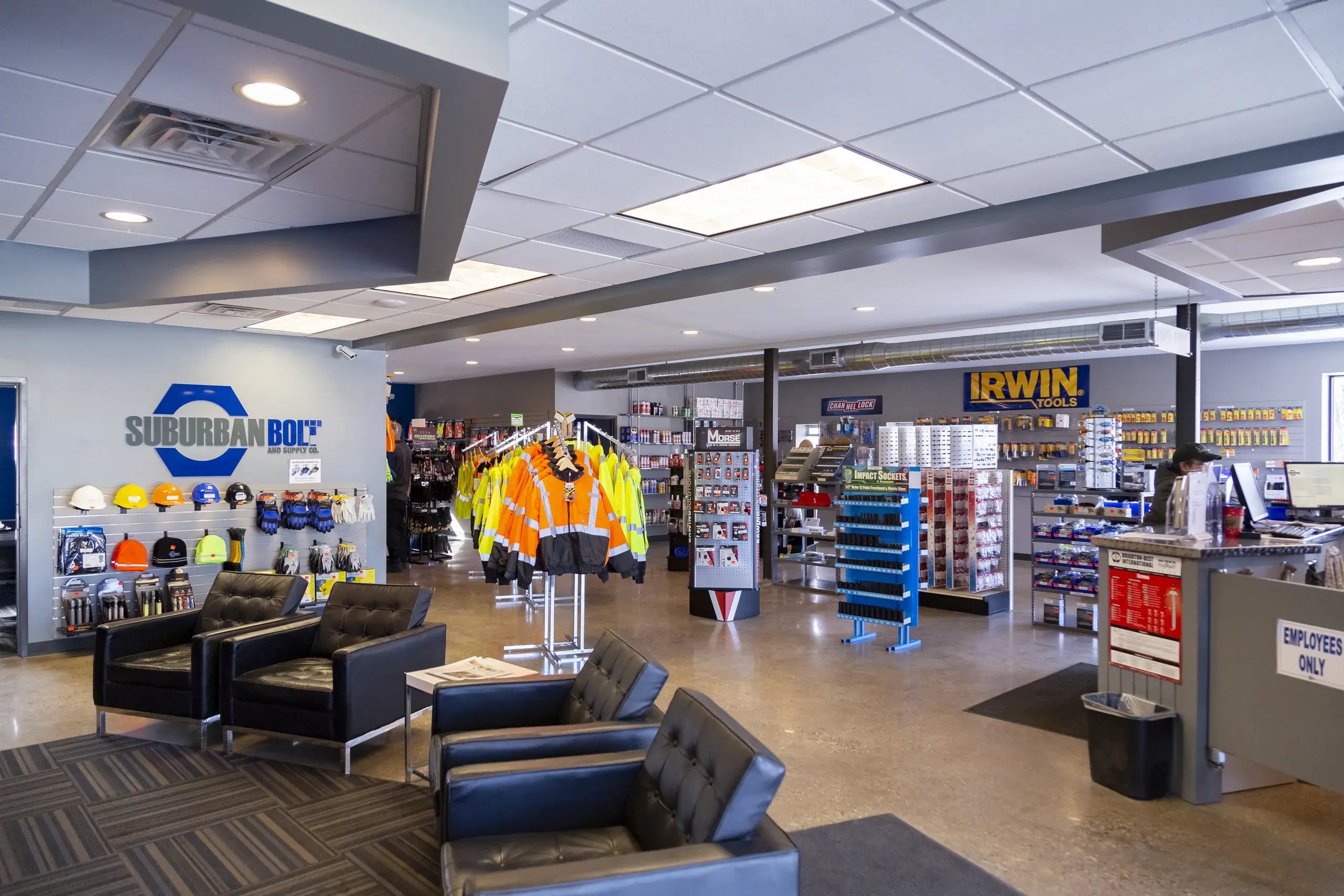 Showroom interior with safety apparel and tool displays and lounge seating